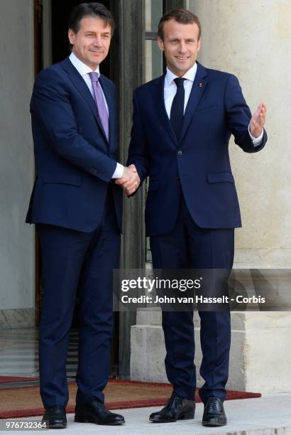 French President Emmanuel Macron receives the new Italian Prime Minister Giuseppe Conte at the Elysee Palace on June 15, 2018 in Paris, France. The...