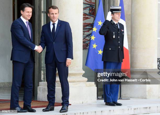 French President Emmanuel Macron receives the new Italian Prime Minister Giuseppe Conte at the Elysee Palace on June 15, 2018 in Paris, France. The...