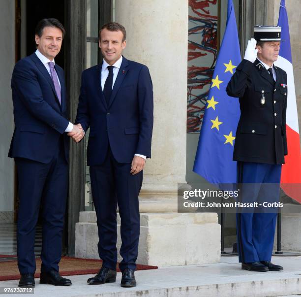 French President Emmanuel Macron receives the new Italian Prime Minister Giuseppe Conte at the Elysee Palace on June 15, 2018 in Paris, France. The...