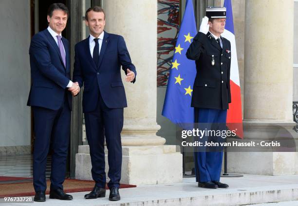 French President Emmanuel Macron receives the new Italian Prime Minister Giuseppe Conte at the Elysee Palace on June 15, 2018 in Paris, France. The...