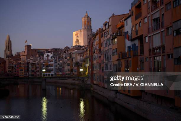 The Onyar River and the cathedral of Saint Mary at sunset, Girona, Spain.