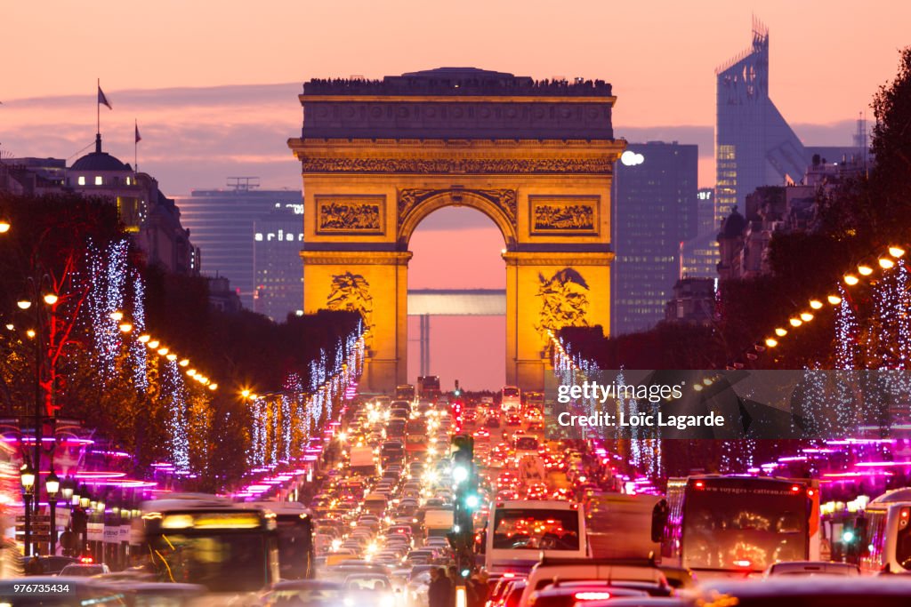 Traffic on street at dusk, Paris, France
