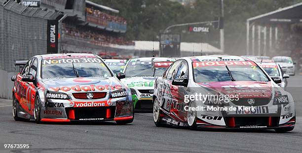 Garth Tander of the Toll Holden Racing Team leads the field through turn one during race one of the Clipsal 500, which is round three of the V8...