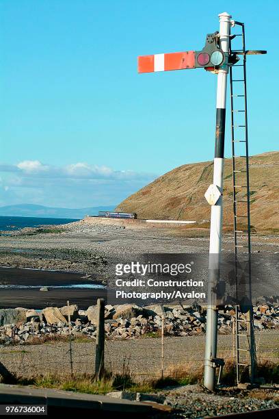 The barrenness of the Cumbrian Coast is emphasised in this view of a Class 156 Sprinter on a Carlisle - Barrow service approaching Parton under the...
