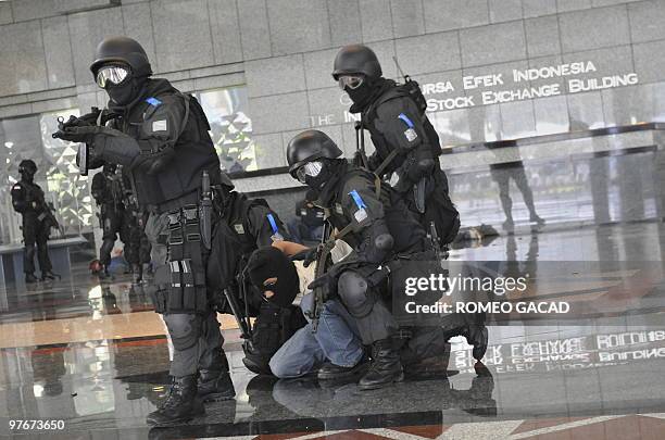 Combined Indonesian elite police forces from Densus 88 and Crisis Response Team with army Kostrad anti-terror commandos capture a "mock terrorist"...