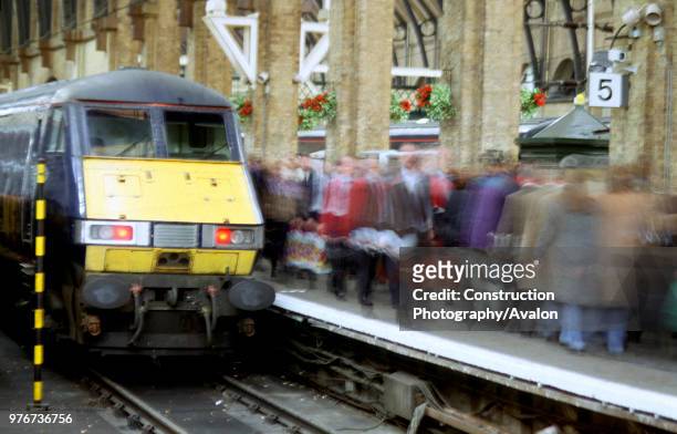 The Class 82/2 DVT at the Kings Cross buffers marks the arrival of a GNER service from the north as passengers hurry past on the busy platform,...