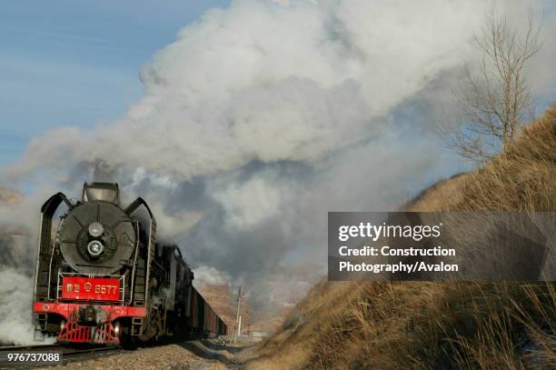 The cutting west of Liudigou Station on the Jing Peng section of the Ji-Tong Railway Inner Mongolia is a superb location for east bound freights...