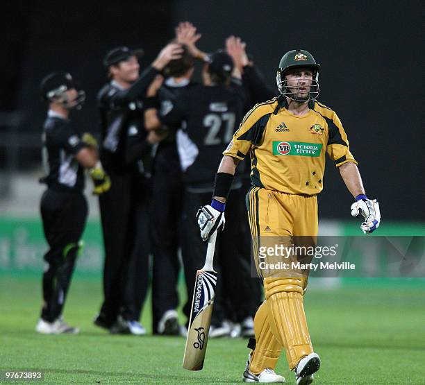 Michael Hussey of Australia walks from the field after being bowled by Tim Southee of the Blackcaps during the 5th ODI match between New Zealand and...