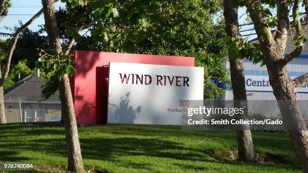 Close-up of sign for technology company Wind River at headquarters on Alameda Island, Alameda, California, June 11, 2018.