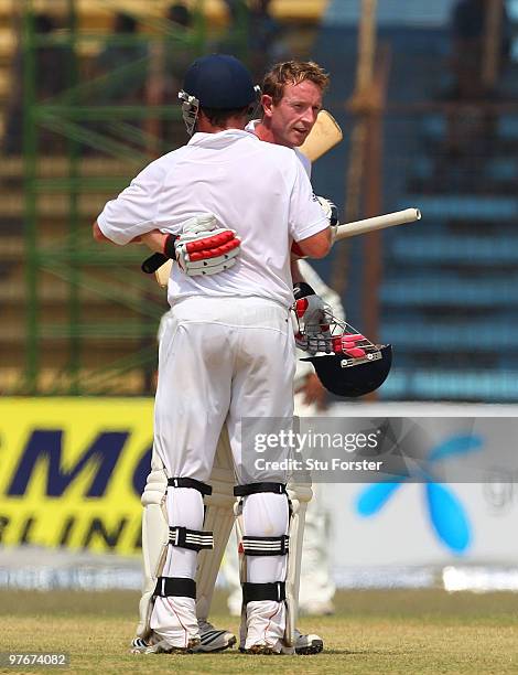 England batsman Paul Collingwood is congratulated by Ian Bell after reaching his century during day two of the 1st Test match between Bangladesh and...