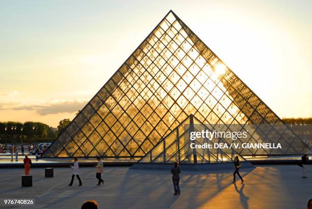 The Louvre pyramid at sunset, Paris , France.