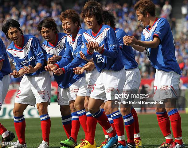 Shunsuke Nakamura of Yokohama F. Marinos celebrates with his teammates after scoring a goal during the J.League match between Yokohama F. Marinos and...