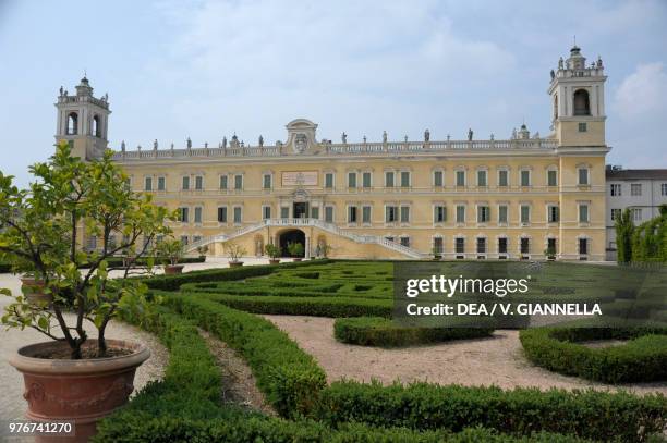 The Ducal Palace of Colorno, designed by the architect Ferdinando Galli Bibiena , seen from the parterre of the French formal garden, Emilia-Romagna,...