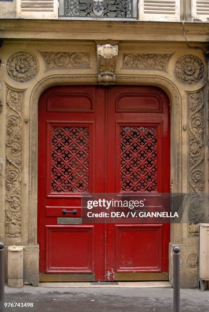 Door of a building in the Pigalle district, Paris, France.