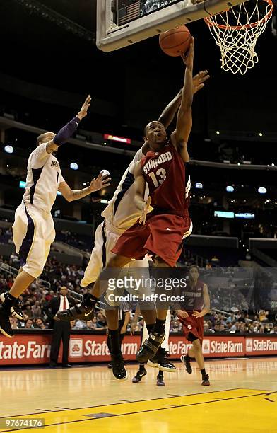 Emmanuel Igbinosa of the Stanford Cardinal drives to the basket for a layup in the second half against the Washington Huskies during the Semifinals...