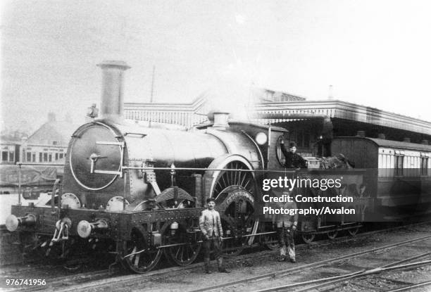 The last up GWR Broad Gauge mail train from Plymouth hauled by Rover Class 4-2-2 Bulkeley taking water at Didcot. 20th May 1892, United Kingdom.