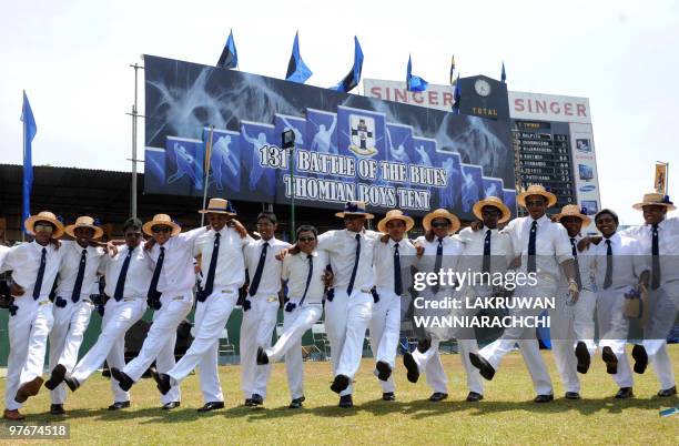 Sri Lankan school students of St Thomas' College pose during a break in play at the 131st annual cricket match against Royal College in Colombo on...