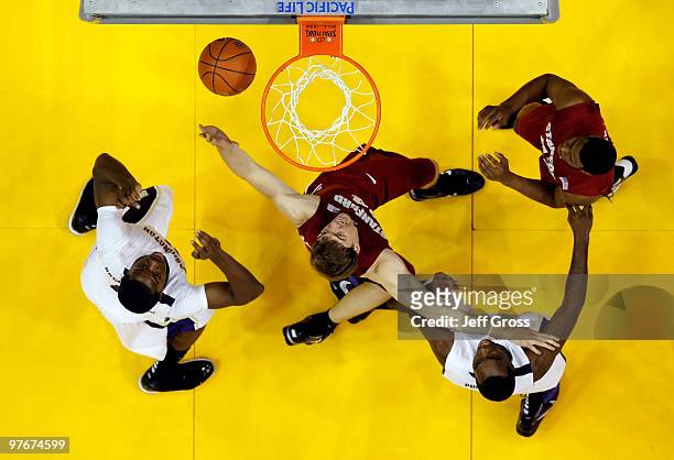 Matthew Bryan-Amaning of the Washington Huskies, Andrew Zimmermann of the Stanford Cardinal, Quincy Pondexter of the Huskies and Jeremy Green of the...