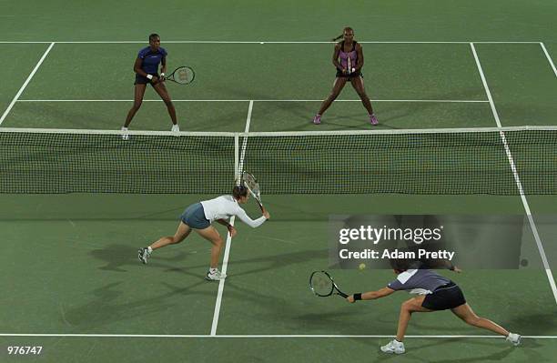 Martina Hingis of Switzerland and Monica Seles of USAin action during their first round doubles match vs Serena and Venus Williams of USA , at the...