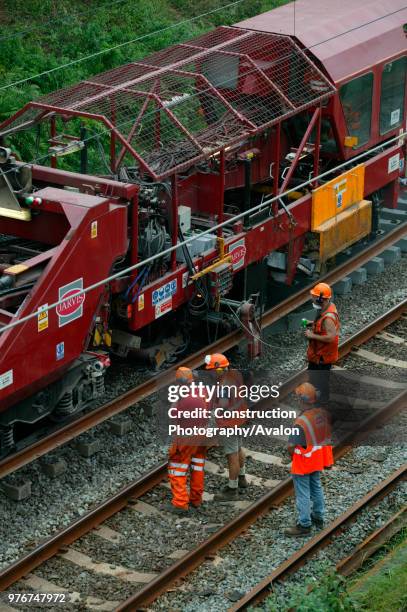 Track relaying machine in action near Poynton as part of the West Coast Main Line upgrade. July 2003, United Kingdom.