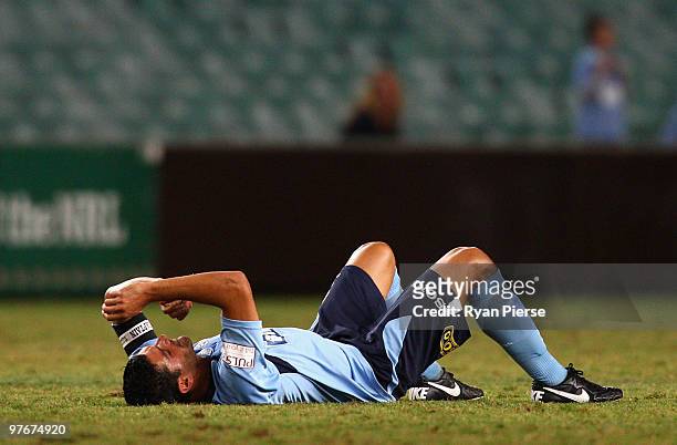 John Aloisi of Sydney lies injured on the ground before leaving the pitch during the A-League preliminary final match between Sydney FC and the...