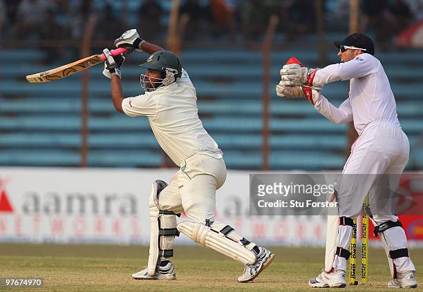 Bangladesh batsman Tamin Iqbal hits out as Matt Prior looks on during day two of the 1st Test between Bangladesh and England at Jahur Ahmed Chowdhury...
