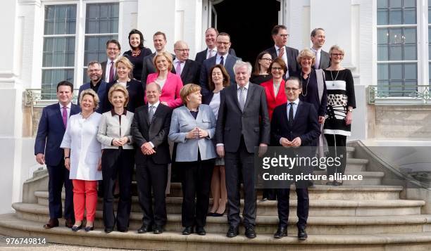 April 2018, Germany, Meseberg: The members of the German government gather for a group picture on the occasion of the closed cabinet meeting outside...