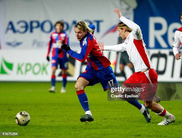 Milos Krasic of PFC CSKA Moscow battles for the ball with Dmitri Belorukov of FC Amkar Perm during the Russian Football League Championship match...