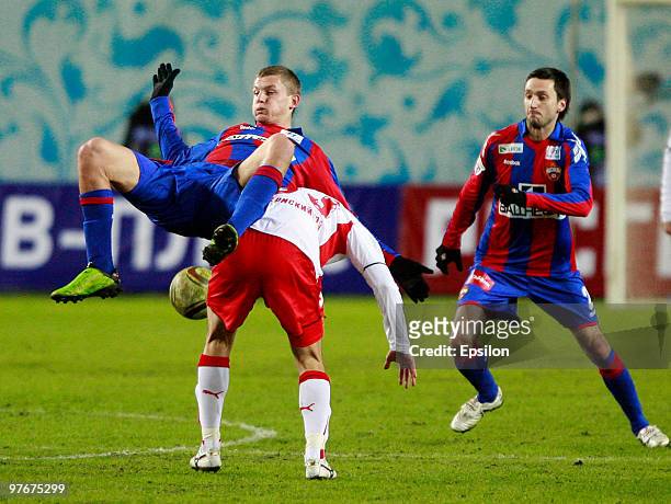 Tomas Necid and Deividas Semberas of PFC CSKA Moscow battles for the ball with Josip Knezevic of FC Amkar Perm during the Russian Football League...