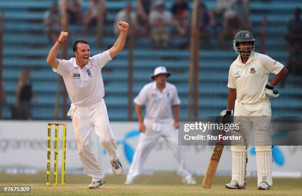 England bowler Graeme Swann celebrates after taking the wicket of Bangladesh batsman Shakib Al Hasan during day two of the 1st Test between...