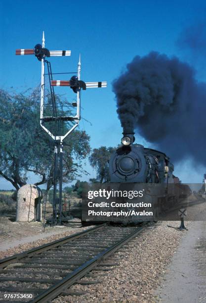 Typically British inside- cylinder 0-6-0 goods engines still work in Pakistan. Here one of these classic machines- superficially resembling the old...