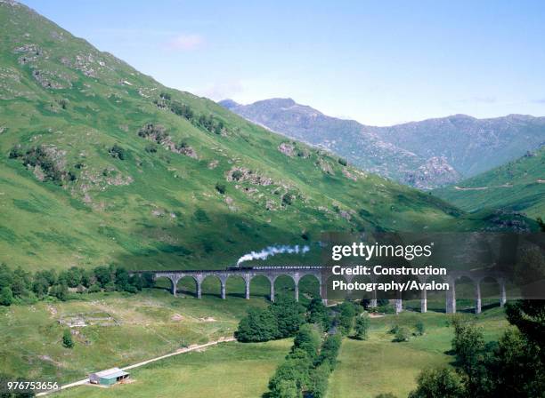 West Highlander. No 44767 'George Stephenson' comes off Glenfinnan Viaduct with the 11.10 from Fort William to Malliag. 19th July 1984, United...