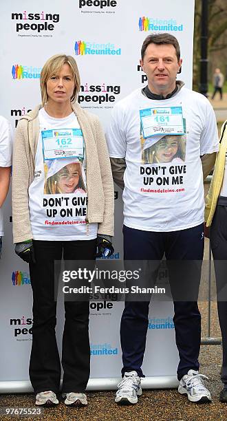 Kate McCann and Gerry McCann, wearing t-shirts printed with a photo of their missing daughter Madeleine, attend the Miles For Missing People 10km...