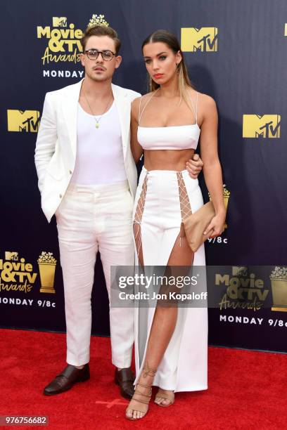 Actor Dacre Montgomery and model Liv Pollock attend the 2018 MTV Movie And TV Awards at Barker Hangar on June 16, 2018 in Santa Monica, California.