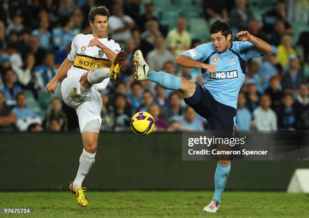 Tony Lockhead of the Phoenix contests the ball with Chris Payne of Sydney FC during the A-League preliminary final match between Sydney FC and the...