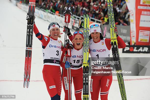 Kristin Stoermer Steira, Therese Johaug and Marit Bjoergen of Norway celebrate after the women's 30km Cross Country Skiing during the FIS World Cup...