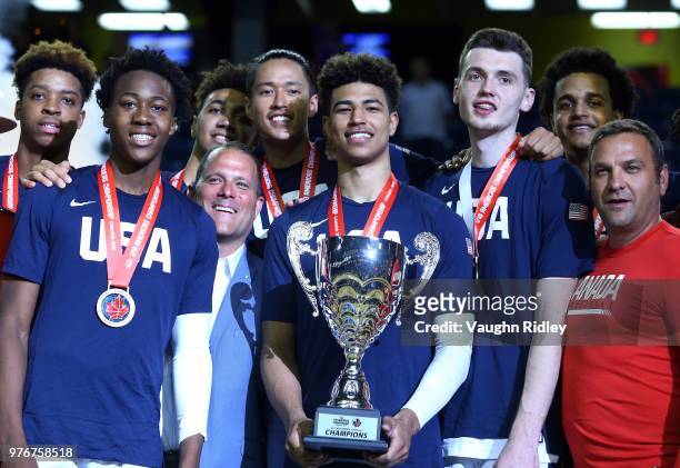 Captain Quentin Grimes of the United States holds the champions trophy after winning Gold against Canada in the final of the FIBA U18 Americas...