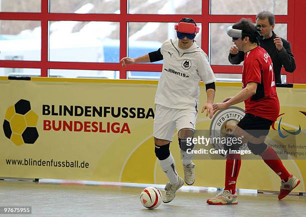Players challenges for the ball during the Blind Football Bundesliga match between MTV Stuttgart and LFC Berlin on March 13, 2010 in Barsinghausen,...