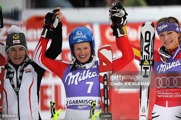 Second placed Austria's Kathrin Zettel, winner Austria's Marlies Schild , and third placed Germany's Maria Riesch pose in the finish area after the...