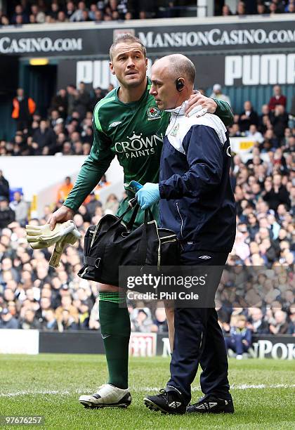 Paul Robinson of Blackburn Rovers is helped from the field after injuring himself during the Barclays Premier League match between Tottenham Hotspur...