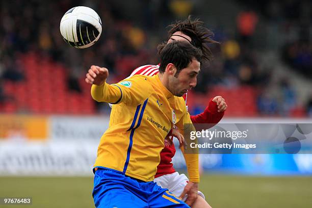 Marco Calamita of Braunschweig is challenged during the 3. Liga match between Eintracht Braunschweig and SpVgg Unterhaching at the Eintracht-Stadion...