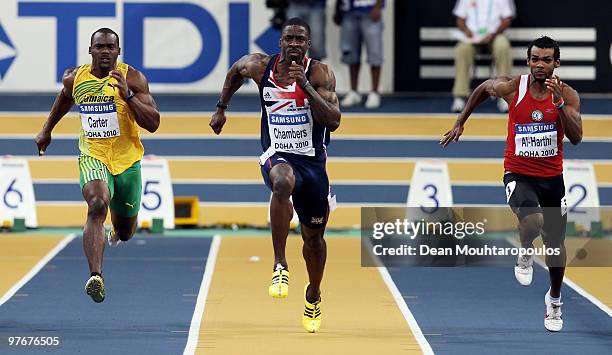 Nesta Carter of Jamaica, Dwain Chambers of Great Britain and Barakat Mubarak Al-Harthi of Oman compete in the Mens 60m Semi Final during Day 2 of the...