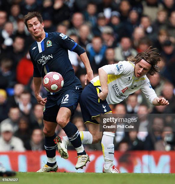 Luka Modric of Tottenham Hotspur challenges Morten Gamst Pedersen of Blackburn Rovers during the Barclays Premier League match between Tottenham...