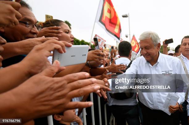 Mexican presidential candidate for the MORENA party, Andres Manuel Lopez Obrador, greets supporters during a campaign rally on June 16, 2018 ahead of...