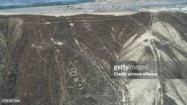 April 2018, Peru, Palpa: An aerial photograph of geometric figures and lines, as well as representations of animals and plants. The newly discovered...