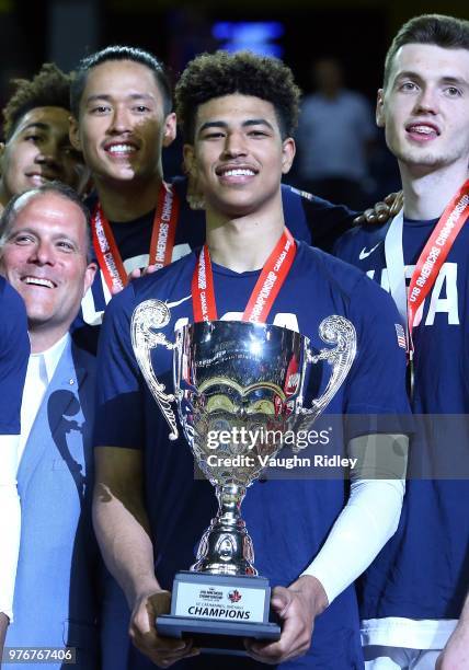 Captain Quentin Grimes of the United States holds the champions trophy after winning Gold against Canada in the final of the FIBA U18 Americas...