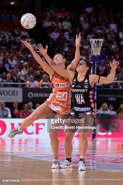 Madi Robinson of the Magpies and Rebecca Bulley of the Giants contest the ball during the round seven Super Netball match between the Giants and the...