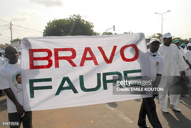 Supporters of the ruling Togolese People's Rally , in power for four decades, backing President Faure Gnassingbe, who say the March 4, 2010 election...