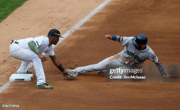 Miguel Andujar of the New York Yankees in action against Marwin Gonzalez of the Houston Astros at Yankee Stadium on May 28, 2018 in the Bronx borough...