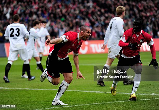 Leon Andreasen of Hannover celebrates scoring his teams first goal with Didier Ya Konan during the Bundesliga match between Hannover 96 and Eintracht...